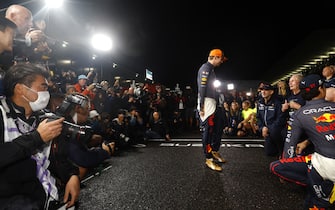 10/9/2022 - Max Verstappen, Red Bull Racing, 1st position, celebrates World Championship victory with Helmut Marko, Consultant, Red Bull Racing, Christian Horner, Team Principal, Red Bull Racing, Sergio Perez, Red Bull Racing, 2nd position, and the Red Bull team during the Formula 1 Japanese Grand Prix in Suzuka, Japan. (Photo by Zak Mauger/Motorsport Images/Sipa USA) France OUT, UK OUT