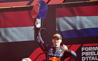 AUTODROMO NAZIONALE MONZA, ITALY - SEPTEMBER 11: Max Verstappen, Red Bull Racing, 1st position, lifts the winners trophy during the Italian GP at Autodromo Nazionale Monza on Sunday September 11, 2022 in Monza, Italy. (Photo by Mark Sutton / Sutton Images)