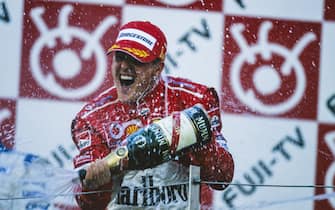 SUZUKA, JAPAN - OCTOBER 10: Michael Schumacher, 1st position, celebrates his 13th victory of the season on the podium during the Japanese GP at Suzuka on October 10, 2004 in Suzuka, Japan. (Photo by LAT Images)