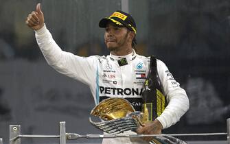 YAS MARINA CIRCUIT, UNITED ARAB EMIRATES - DECEMBER 01: Lewis Hamilton, Mercedes AMG F1, 1st position, leaves the podium with his trophy during the Abu Dhabi GP at Yas Marina Circuit on December 01, 2019 in Yas Marina Circuit, United Arab Emirates. (Photo by Steve Etherington / LAT Images)