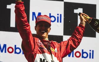 HOCKENHEIMRING, GERMANY - DECEMBER 21: Michael Schumacher, 1st position, celebrates victory on the podium during the German GP at Hockenheimring on December 21, 2017 in Hockenheimring, Germany. (Photo by LAT Images)