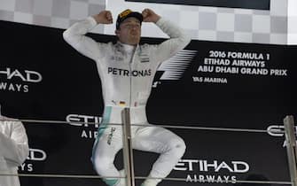 YAS MARINA CIRCUIT, UNITED ARAB EMIRATES - NOVEMBER 27: Nico Rosberg, 2nd position, celebrates world championship victory on the podium during the Abu Dhabi GP at Yas Marina Circuit on November 27, 2016 in Yas Marina Circuit, United Arab Emirates. (Photo by Rainer Schlegelmilch)