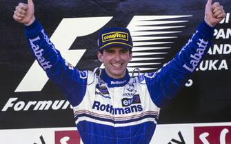 SUZUKA, JAPAN - OCTOBER 13: Damon Hill, 1st position, celebrates victory and becoming world drivers' champion during the Japanese GP at Suzuka on October 13, 1996 in Suzuka, Japan. (Photo by LAT Images)