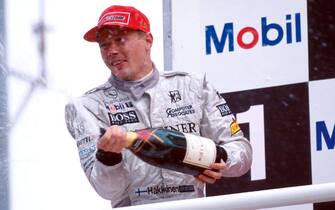Winner Mika Hakkinen (FIN), McLaren MP4-13 celebrates is win in style.
Formula One World Championship, Rd 11, German Grand Prix, Hockenheim, Germany, 2 August 1998.