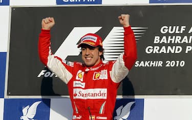 Bahrain International Circuit, Sakhir, Bahrain
14th March 2010
Fernando Alonso, Ferrari F10, 1st position, celebrates victory on the podium. Portrait. Podium. 
World Copyright: Glenn Dunbar/LAT Photographic
ref: Digital Image _G7C0891