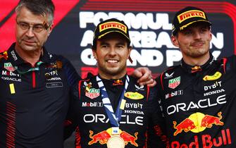 BAKU CITY CIRCUIT, AZERBAIJAN - APRIL 30: The Red Bull trophy delegate, Sergio Perez, Red Bull Racing, 1st position, and Max Verstappen, Red Bull Racing, 2nd position, on the podium during the Azerbaijan GP at Baku City Circuit on Sunday April 30, 2023 in Baku, Azerbaijan. (Photo by Zak Mauger / LAT Images)