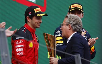 RED BULL RING, AUSTRIA - JULY 02: Charles Leclerc, Scuderia Ferrari, 2nd position, receives his trophy on the podium during the Austrian GP at Red Bull Ring on Sunday July 02, 2023 in Spielberg, Austria. (Photo by Steven Tee / LAT Images)