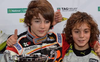 (L to R): Charles Leclerc (FRA) and Dorian Boccolacci (FRA) celebrate on the podium.
ERDF Masters Karting, Bercy, Paris, France, 10-11 December 2011.