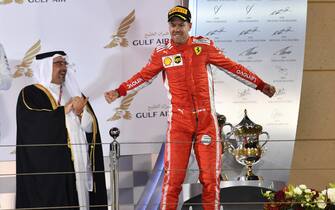 BAHRAIN INTERNATIONAL CIRCUIT, BAHRAIN - APRIL 08: Race winner Sebastian Vettel (GER) Ferrari celebrates on the podium during the Bahrain GP at Bahrain International Circuit on April 08, 2018 in Bahrain International Circuit, Bahrain. (Photo by Mark Sutton / Sutton Images)