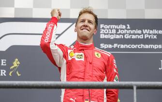 SPA-FRANCORCHAMPS, BELGIUM - AUGUST 26: Sebastian Vettel, Ferrari, 1st position, celebrates on the podium during the Belgian GP at Spa-Francorchamps on August 26, 2018 in Spa-Francorchamps, Belgium. (Photo by Zak Mauger / LAT Images)