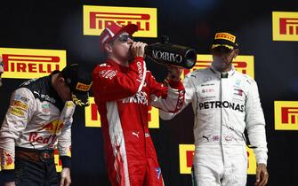 CIRCUIT OF THE AMERICAS, UNITED STATES OF AMERICA - OCTOBER 21: Kimi Raikkonen, Ferrari, 1st position, celebrates with Champagne on the podium during the United States GP at Circuit of the Americas on October 21, 2018 in Circuit of the Americas, United States of America. (Photo by Andy Hone / LAT Images)