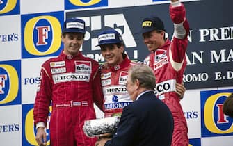 IMOLA, ITALY - APRIL 28: Ayrton Senna, 1st position, Gerhard Berger, 2nd position, and J J Lehto, 3rd position, celebrate on the podium during the San Marino GP at Imola on April 28, 1991 in Imola, Italy. (Photo by Rainer Schlegelmilch)
