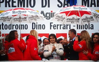 Race winner Nelson Piquet (BRA), Brabham, celebrates his victory on the podium.San Marino Grand Prix, Rd4, Imola, San Marino, Italy. 3 May 1981.BEST IMAGE