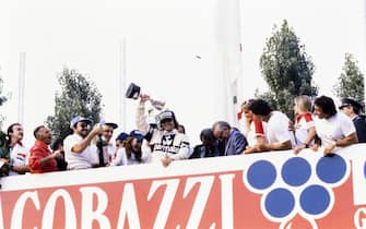 AUTODROMO NAZIONALE MONZA, ITALY - SEPTEMBER 14: Nelson Piquet, 1st position, celebrates on the podium during the Italian GP at Autodromo Nazionale Monza on September 14, 1980 in Autodromo Nazionale Monza, Italy. (Photo by LAT Images)