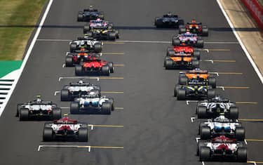 The cars leave the starting grid at the beginning the race during the F1 70th Anniversary Grand Prix at Silverstone on August 9, 2020 in Northampton. - The race commemorates the 70th anniversary of the inaugural world championship race, held at Silverstone in 1950. (Photo by Bryn Lennon / POOL / AFP) (Photo by BRYN LENNON/POOL/AFP via Getty Images)