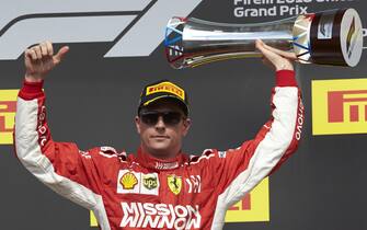 CIRCUIT OF THE AMERICAS, UNITED STATES OF AMERICA - OCTOBER 21: Kimi Raikkonen, Ferrari, 1st position, lifts his trophy on the podium during the United States GP at Circuit of the Americas on October 21, 2018 in Circuit of the Americas, United States of America. (Photo by Steve Etherington / LAT Images)