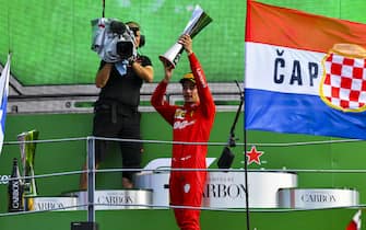 AUTODROMO NAZIONALE MONZA, ITALY - SEPTEMBER 08: Charles Leclerc, Ferrari, 1st position, lifts the winners trophy during the Italian GP at Autodromo Nazionale Monza on September 08, 2019 in Autodromo Nazionale Monza, Italy. (Photo by Mark Sutton / Sutton Images)