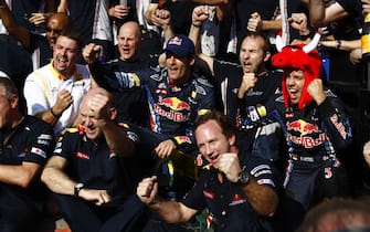 Interlagos, Sao Paulo, Brazil.
7th November 2010.
Christian Horner, Team Principal, Red Bull Racing, Adrian Newey, Chief Technical Officer, Red Bull Racing, Mark Webber, Red Bull Racing RB6 Renault, 2nd position, Sebastian Vettel, Red Bull Racing RB6 Renault, 1st position, and the Red Bull team celebrate wining the constructors trophy. Portrait. Atmosphere. 
World Copyright: Glenn Dunbar/LAT Photographic
ref: Digital Image _G7C6083