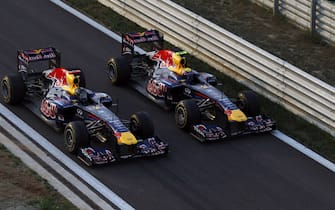 Korea International Circuit, Yeongam-Gun,South Korea.16th October 2011.Sebastian Vettel, Red Bull Racing RB7 Renault, 1st position, and Mark Webber, Red Bull Racing RB7 Renault, 3rd position, drive to Parc Ferme in formation after securing the Constructors title for Red Bull. Action. Finish. World Copyright:Charles Coates/LAT Photographicref: Digital Image _X5J9638