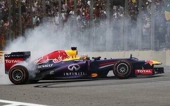 Interlagos, Sao Paulo, Brazil.
Sunday 24rd November 2013. 
Sebastian Vettel, Red Bull RB9 Renault, 1st position, celebrates victory with donuts.
World Copyright: Andy Hone/LAT Photographic.
ref: Digital Image _ONY0949