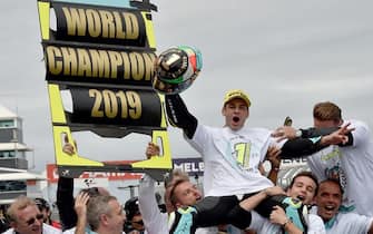 Leopard Racing Team Moto3 rider Lorenzo Dalla Porta of Italy (R) celebrates with his team after winning the Moto3 race and the World Championship at the Australian motorcycle Grand Prix at Phillip Island on October 27, 2019. (Photo by PETER PARKS / AFP) / -- IMAGE RESTRICTED TO EDITORIAL USE - STRICTLY NO COMMERCIAL USE -- (Photo by PETER PARKS/AFP via Getty Images)