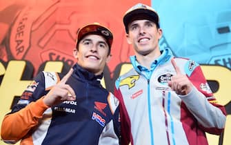 1181074133 Repsol Honda Team's Spanish rider Marc Marquez (L) and his brother EG 0,0 Marc VDS's Spanish rider Alex Marquez pose during a press conference few hours before celebrating their MotoGP and Moto2 titles in Cervera on November 9, 2019. - Marc Marquez on October 6 sealed his sixth MotoGP title in Buriram, Thailand, while his brother Alex became Moto2 world champion on November 3 in the Malaysian city of Sepang. (Photo by JOSE JORDAN / AFP) (Photo by JOSE JORDAN/AFP via Getty Images)