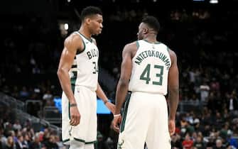 MILWAUKEE, WISCONSIN - OCTOBER 09:  Giannis Antetokounmpo #34 and Thanasis Antetokounmpo #43 of the Milwaukee Bucks meet in the second quarter against the Utah Jazz during a preseason game at Fiserv Forum on October 09, 2019 in Milwaukee, Wisconsin. NOTE TO USER: User expressly acknowledges and agrees that, by downloading and or using this photograph, User is consenting to the terms and conditions of the Getty Images License Agreement. (Photo by Dylan Buell/Getty Images)