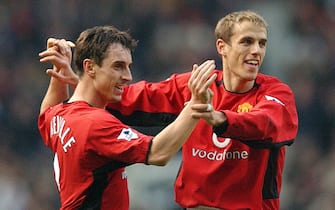MANCHESTER, ENGLAND - DECEMBER 14:  Gary Neville and Phil Neville celebrate Man Utd's first goal of the match during the FA Barclaycard Premiership match between Manchester United v West Ham United at Old Trafford on December 7, 2002 in Manchester, England.  (Photo by John Peters/Manchester United via Getty Images)