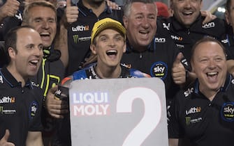 DOHA, QATAR - MARCH 07: Luca Marini of Italy and Sky Racing Team VR46 
 celebrates the Moto2 second place with team during the Moto2 & Moto3 GP Of Qatar - Qualifying at Losail Circuit on March 07, 2020 in Doha, Qatar. (Photo by Mirco Lazzari gp/Getty Images)