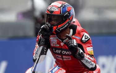 Ducati's Italian rider Danilo Petrucci celebrates as he crosses the finish line to wins in the French MotoGP race in Le Mans, northwestern France, on October 11, 2020. (Photo by JEAN-FRANCOIS MONIER / AFP) (Photo by JEAN-FRANCOIS MONIER/AFP via Getty Images)
