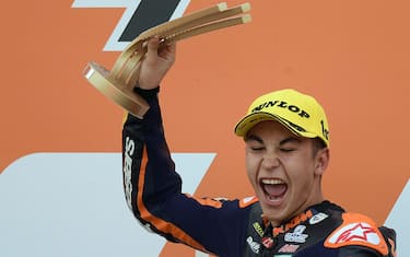 Red Bull KTM Ajo's Spanish rider Raul Fernandez celebrates on the podium after winning the Moto3 race of the European Grand Prix at the Ricardo Tormo circuit in Valencia on November 8, 2020. (Photo by JOSE JORDAN / AFP) (Photo by JOSE JORDAN/AFP via Getty Images)