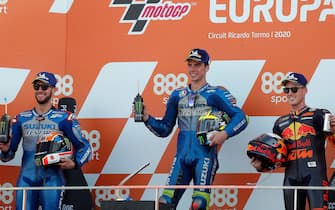 epa08807596 Spanish MotoGP rider Joan Mir (C) celebrates his victory on the podium next to second placed Alex Rins(L) and third placed Pol Espargaro (R) after the race of the Motorcycling Grand Prix of Europe at Ricardo Tormo circuit in Cheste, eastern Spain, 08 November 2020.  EPA/Kai Foersterling