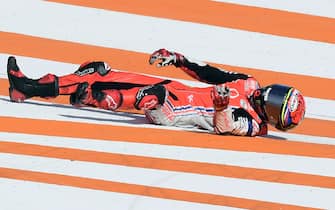 TOPSHOT - Reale Avintia Racing's Spanish rider Tito Rabat lays on the ground after crashing during the MotoGP race of the European Grand Prix at the Ricardo Tormo circuit in Valencia on November 8, 2020. (Photo by JOSE JORDAN / AFP) (Photo by JOSE JORDAN/AFP via Getty Images)