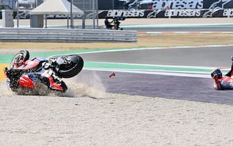 Pramac Racing's Italian rider Francesco Bagnaia rolls on the ground after he crashed during the Emilia Romagna MotoGP Grand Prix at the Misano World Circuit Marco Simoncelli on September 20, 2020. (Photo by ANDREAS SOLARO / AFP) (Photo by ANDREAS SOLARO/AFP via Getty Images)