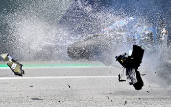 TOPSHOT - Bike of Italtrans Racing Team Italian rider Enea Bastianini is hit by another bike during a crash during the Moto2 Austrian Grand Prix at Red Bull Ring circuit in Spielberg, Austria on August 16, 2020. (Photo by JOE KLAMAR / AFP) (Photo by JOE KLAMAR/AFP via Getty Images)