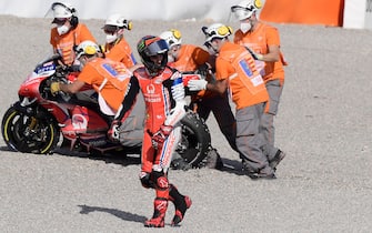 Reale Avintia Racing's Spanish rider Tito Rabat walks as his motorcycle is removed after crashing during the MotoGP race of the European Grand Prix at the Ricardo Tormo circuit in Valencia on November 8, 2020. (Photo by JOSE JORDAN / AFP) (Photo by JOSE JORDAN/AFP via Getty Images)