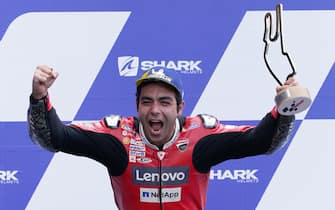 epa08735614 Italian MotoGP rider Danilo Petrucci of Ducati Team celebrates his victory on the podium at the motorcycling Grand Prix of France in Le Mans, France, 11 October 2020.  EPA/EDDY LEMAISTRE