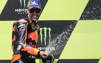epa08593287 South African rider Brad Binder of Red Bull KTM Factory Racing team celebrates on the podium after winning  the MotoGP race of the Motorcycling Grand Prix of the Czech Republic at Masaryk circuit in Brno, Czech Republic, 09 August 2020.  EPA/MARTIN DIVISEK