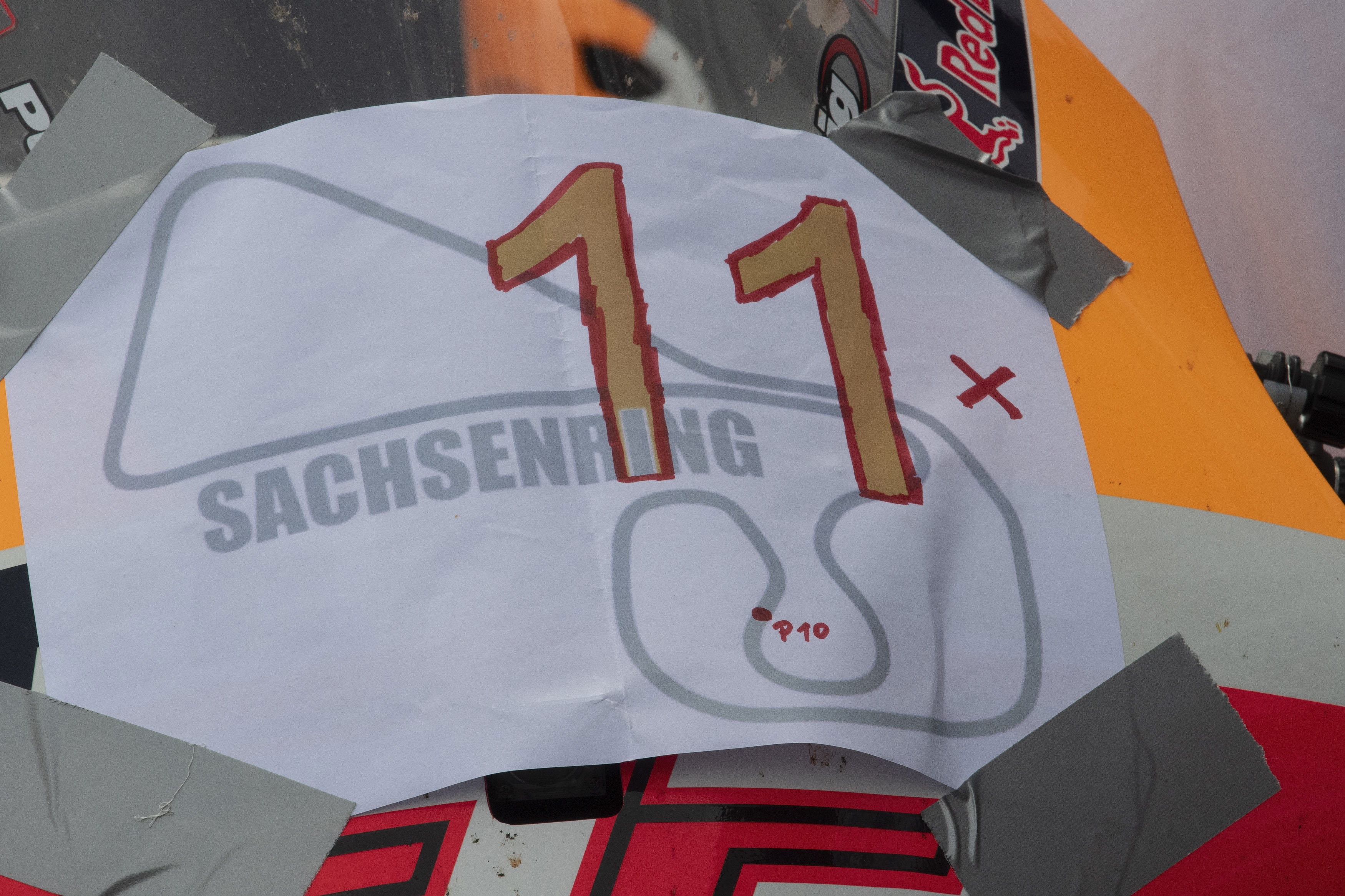 1324553245 HOHENSTEIN-ERNSTTHAL, GERMANY - JUNE 20: The bike of Marc Marquez of Spain and Repsol Honda Team celebrates the victory (eleven consecutive wins in this circuit) during the MotoGP race during the MotoGP of Germany - Race at Sachsenring Circuit on June 20, 2021 in Hohenstein-Ernstthal, Germany. (Photo by Mirco Lazzari gp/Getty Images)
