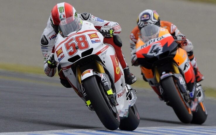 Un duello in MotoGP tra Marco Simoncelli e Andrea Dovizioso, il 2 ottobre 2011 a Motegi