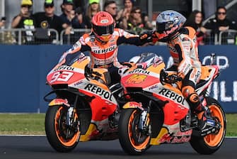 Race winner Honda Spanish rider Marc Marquez (L) and second-placed Honda Spanish rider Pol Espargaro celebrate on October 24, 2021 after the Emilia-Romagna MotoGP Grand Prix at the Misano World Circuit Marco-Simoncelli in Misano Adriatico, Italy. (Photo by ANDREAS SOLARO / AFP) (Photo by ANDREAS SOLARO/AFP via Getty Images)