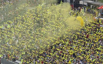 SPIELBERG, AUSTRIA - AUGUST 15: Fans of Valentino Rossi with yellow smoke during the MotoGP of Austria - Race at Red Bull Ring on August 15, 2021 in Spielberg, Austria. (Photo by Guenther Iby/SEPA.Media /Getty Images)