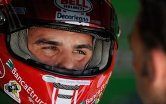 MISANO ADRIATICO, ITALY - JUNE 19:  Luca Scassa of Italy and Team Pedercini   looks on in the garage  during the qualifying session of round eight of the Superbike World Championship at the Misano World Circuit on June 19, 2009 in Misano Adriatico, Italy.  (Photo by Mirco Lazzari/Getty Images)