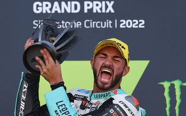 Leopard racing Italian rider Dennis Foggia holds the trophy during the podium ceremony as  he celebrates his victory in the Moto 3 race as part of the Moto GP race of the British Grand Prix at Silverstone circuit in Northamptonshire, central England, on August 7, 2022. (Photo by ADRIAN DENNIS / AFP) (Photo by ADRIAN DENNIS/AFP via Getty Images)