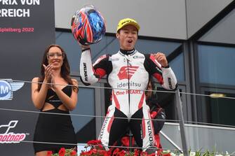 Idemitsu Honda Team Asia's Japanese rider Ai Ogura celebrates on the podium after winning the Moto2 Austrian Grand Prix at the Redbull Ring racetrack in Spielberg on August 21, 2022. (Photo by VLADIMIR SIMICEK / AFP) (Photo by VLADIMIR SIMICEK/AFP via Getty Images)