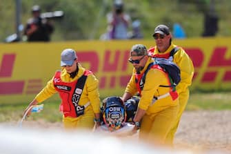 epa10544091 Medics carry Portuguese MotoGP rider Miguel Oliveira of CryptoDATA RNF MotoGP Team after suffering a crash during the MotoGP race at the Motorcycle Grand Prix of Portugal at Algarve International race track, Portimao, Portugal, 26 March 2023.  EPA/NUNO VEIGA
