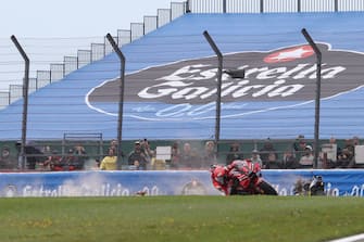SILVERSTONE CIRCUIT, UNITED KINGDOM - AUGUST 06: Francesco Bagnaia, Ducati Team, Marco Bezzecchi, VR46 Racing Team crash during the British GP at Silverstone Circuit on Sunday August 06, 2023 in Northamptonshire, United Kingdom. (Photo by Gold and Goose / LAT Images)