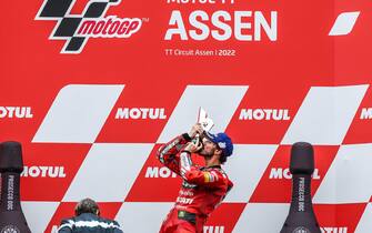 epa10035203 Francesco Bagnaia of Italy of the Ducati Lenovo Team celebrates on the podium winning the MotoGP race of the Motorcycling Grand Prix of the Netherlands at the TT circuit of Assen, Netherlands, 26 June 2022.  EPA/Vincent Jannink