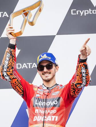 epa10131864 First placed Italian Francesco Bagnaia of Ducati Team celebrates on the podium after the MotoGP race of the motorcycling Grand Prix of Austria at Red Bull Ring in Spielberg, Austria, 21 August 2022.  EPA/DOMINIK ANGERER