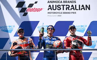 epa10246445 First place Alex Rins of Spain riding for Suzuki Ecstar (C) celebrates on the podium with second place Marc Marquez of Spain riding for Repsol Honda Team (L) and third place Francesco Bagnaia of Italy riding for Ducati Lenovo Team (R) after the MotoGP race  race at the Australian Motorcycle Grand Prix at the Phillip Island Grand Prix Circuit on Phillip Island, Victoria, Australia, 16 October 2022.  EPA/JOEL CARRETT AUSTRALIA AND NEW ZEALAND OUT